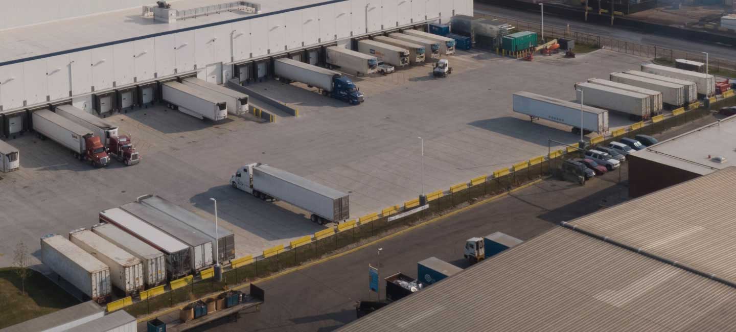 semi trucks parked at loading dock