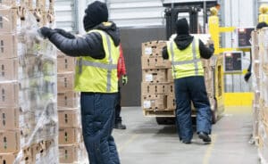 Capstone employees working in food warehouse