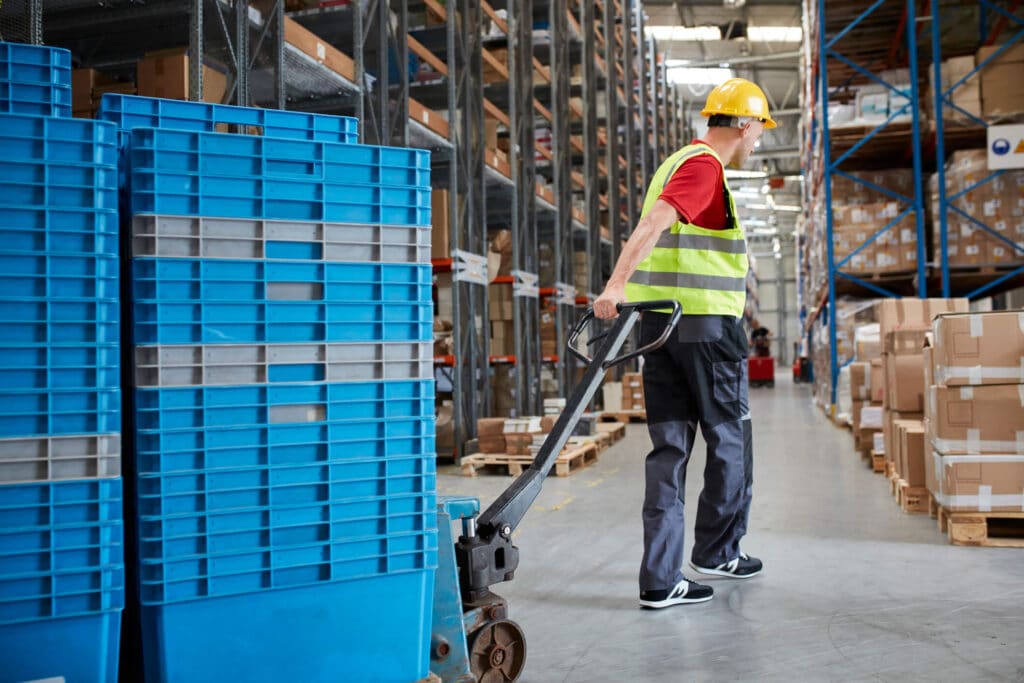 warehouse worker moving equipment