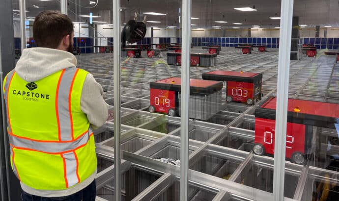 capstone employee overlooking automation line