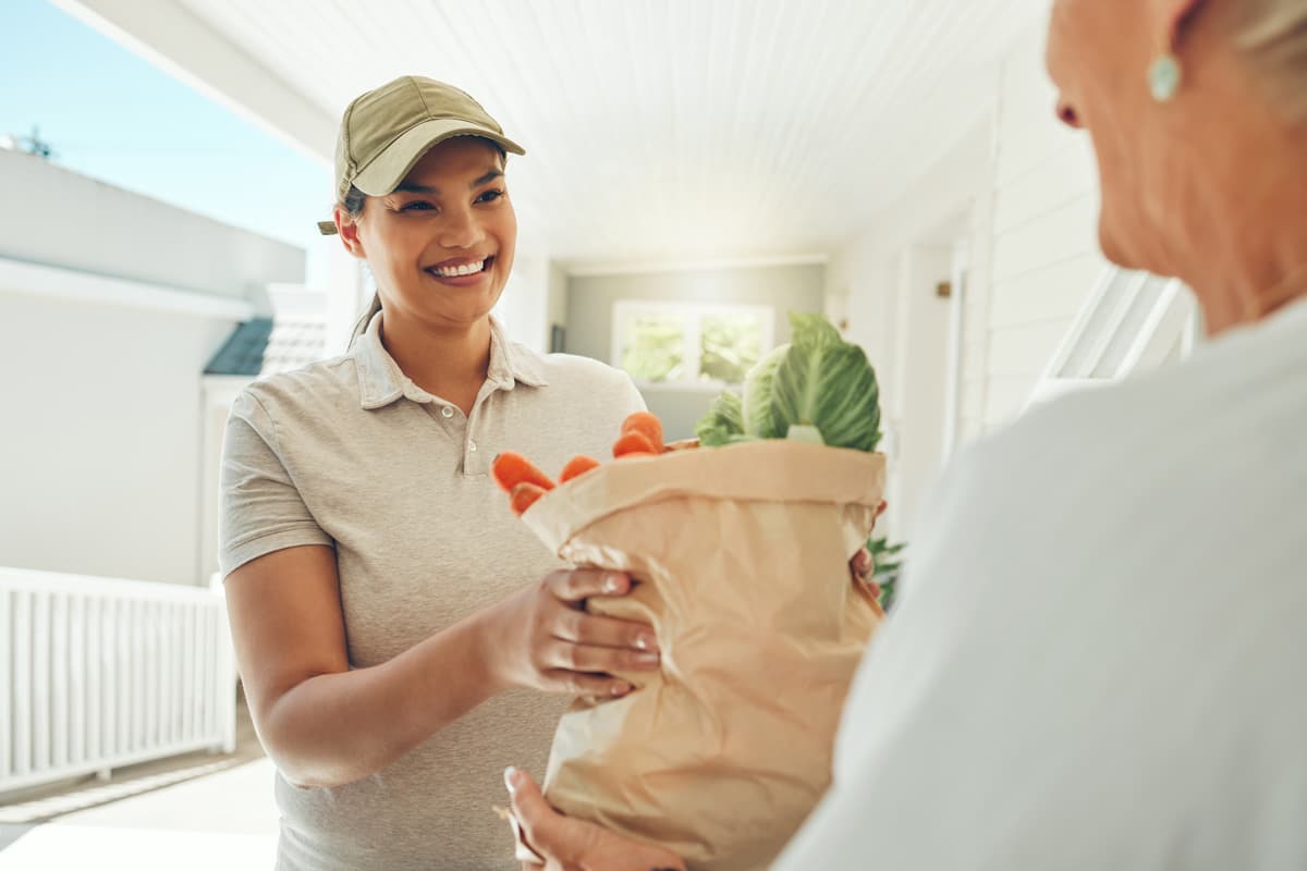 smiling female grocery delivery lady