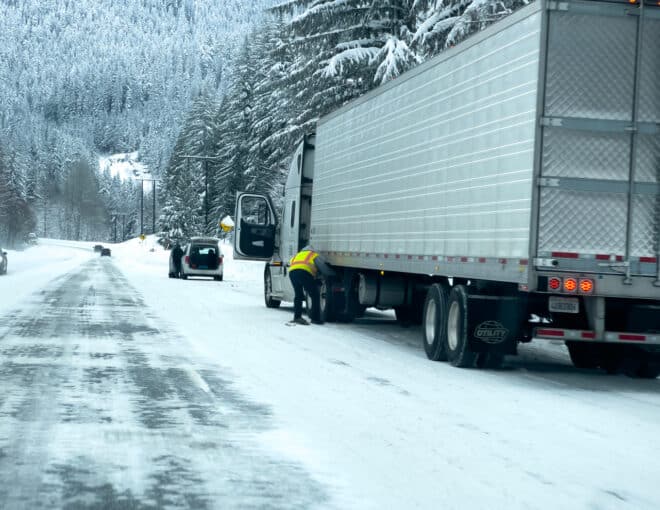 picture of a truck driver stuck in the winter weather